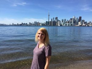 This is a picture of Eva in front of the Toronto skyline.