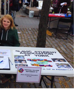 This is a picture of Eva at a table for the Slavic Student Association at YorkFest