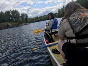 Aliya in a canoe on Bell Lake looking for Loons